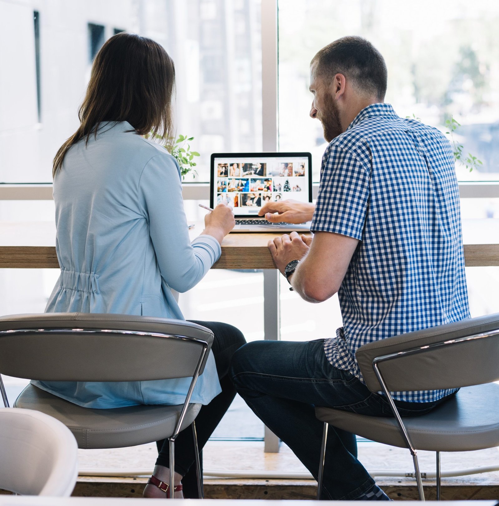 back-view-colleagues-workin111g-laptop